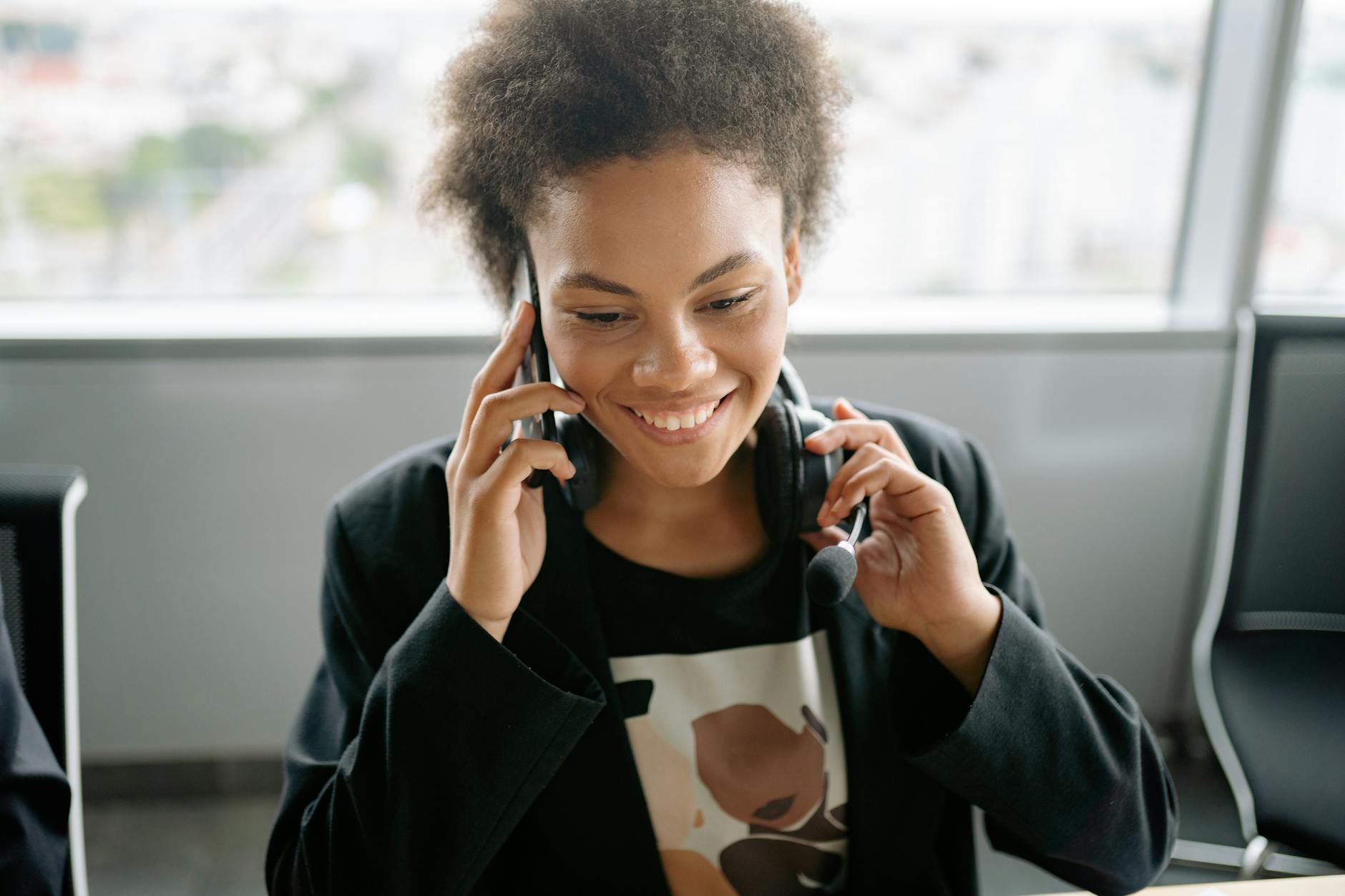 Woman smiling while talking on the phone